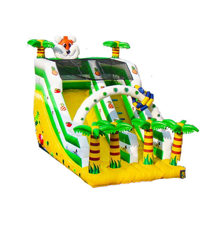 Yellow And Green Inflatable Slide With Tropical Theme And Palm Tree Decorations